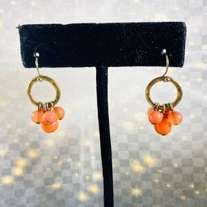 Itty Bitty little clusters of glass beads on little gold hoops.